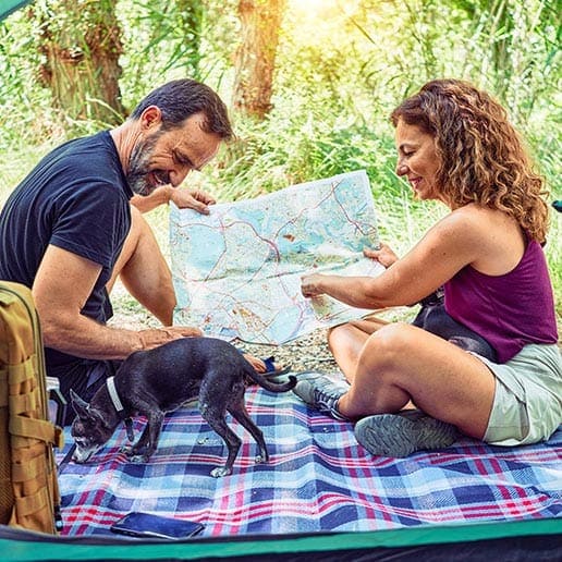 man and woman looking at a map