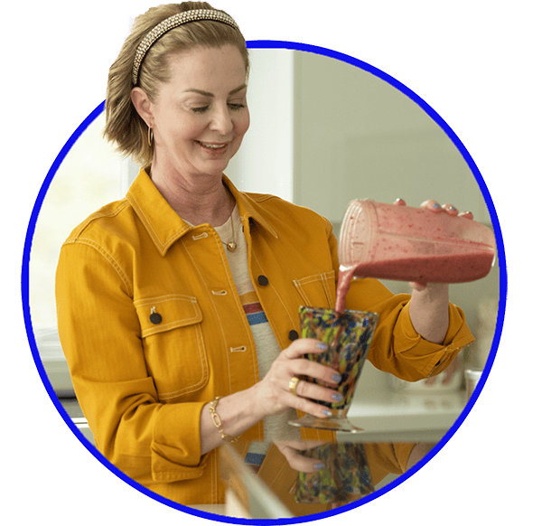 Woman pouring smoothie