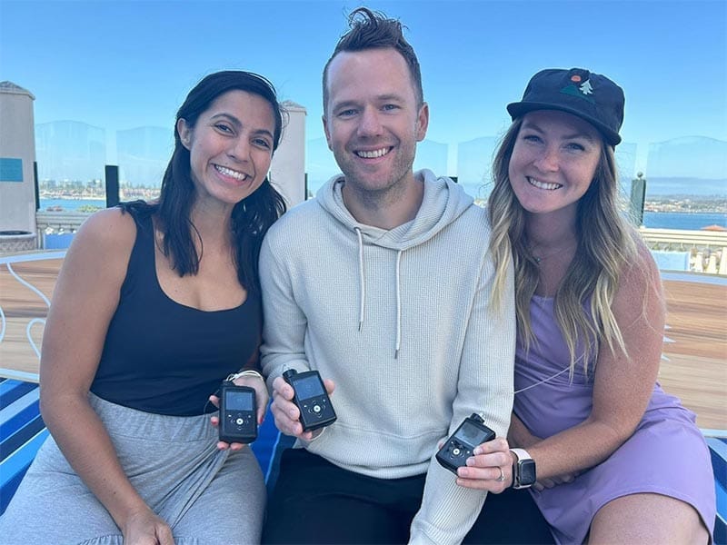 Man and women holding the MiniMed insulin pump