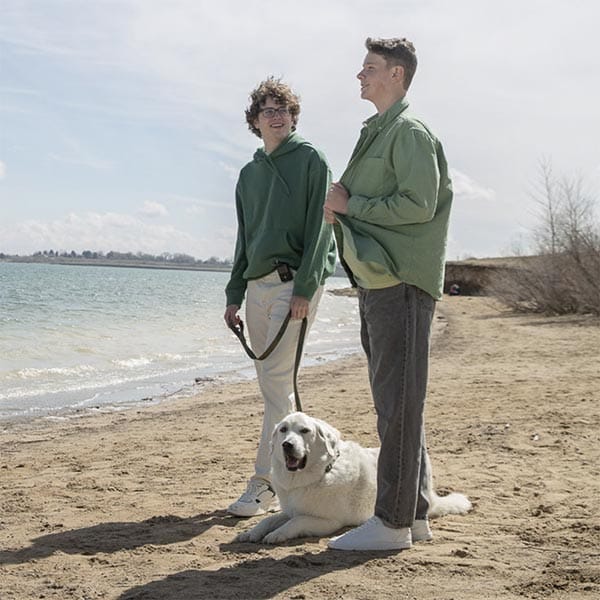 two boys on a beach with insulin pump